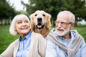 A mature couple with a dog