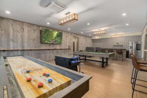 Community room with (other random amenity - coffee bar, video games, shuffleboard, fireplace)