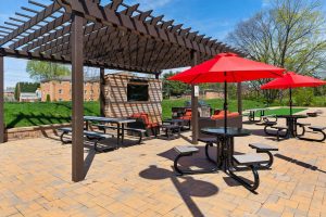 East of Market outdoor pergola with grilling area and seating